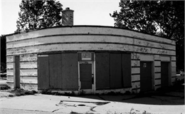 Rounded gas station before restoration.