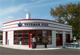 Gas station turned into a coffee shop with fresh paint and restored historic features.