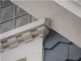 Image of a drip cap with a steep angle installed over a window.
