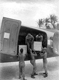 Soldiers loading crates of blood at Falalop Island.