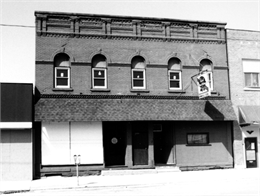 Exterior of commercial main street brick buildings.
