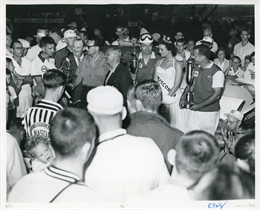 Crowd of onlookers watch as winner Tim Flock and runner-up Billy Meyers are presented the winning trophies by 1956 Miss Wisconsin, Linn Byron Holden