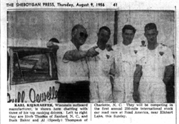 Mercury Marine team owner and operator Carl Kiekhaefer of Fond du Lac with his drivers, Herb Thomas, Buck Baker, and Speedy Thompson before the 1956 NASCAR Grand National race at Road America.