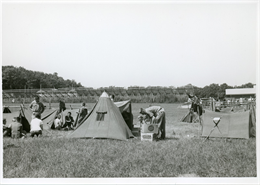 Boy Scouts set up campsite behind bleachers at Road America’s start-finish line in 1961