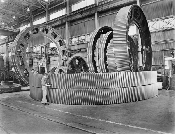 Large ring gears in various stages of manufacture waiting for subsequent machining operations.