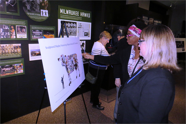 Guests review the early exhibit design concept renderings for the new Wisconsin history museum Oct. 24 during the Society's public engagement session in Milwaukee.