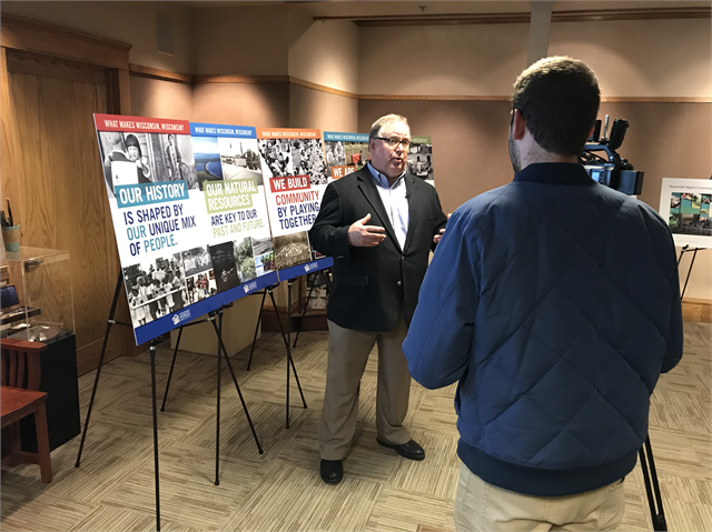 Wisconsin Historical Society Ruth and Hartley Barker Director Christian Øverland speaks with a reporter from Madison's WISC-TV (Ch. 3) during the session.