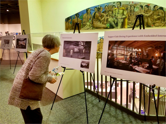 A guest examines an early concept exhibit design rendering during the Wisconsin Historical Society's Feb. 12, 2019 "Share Your Voice" new museum public listening session in Green Bay.