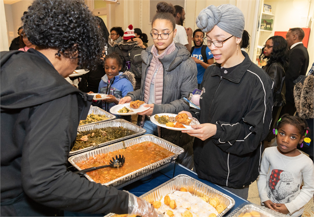 Guests enjoy a soul food feast from Madison caterer Melly Mel's Feb. 19, 2019 in the lobby of the Wisconsin Historical Society in Madison, where a "Share Your Voice" new museum session was held in conjunction with its Black History Month Open House.