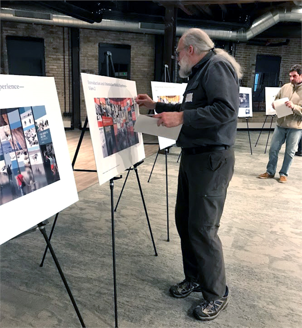 Guests place stickers on early concept exhibit design renderings during an exercise at the Wisconsin Historical Society's "Share Your Voice" new museum listening session held Feb. 21, 2019 at the Goodman Community Center in Madison.