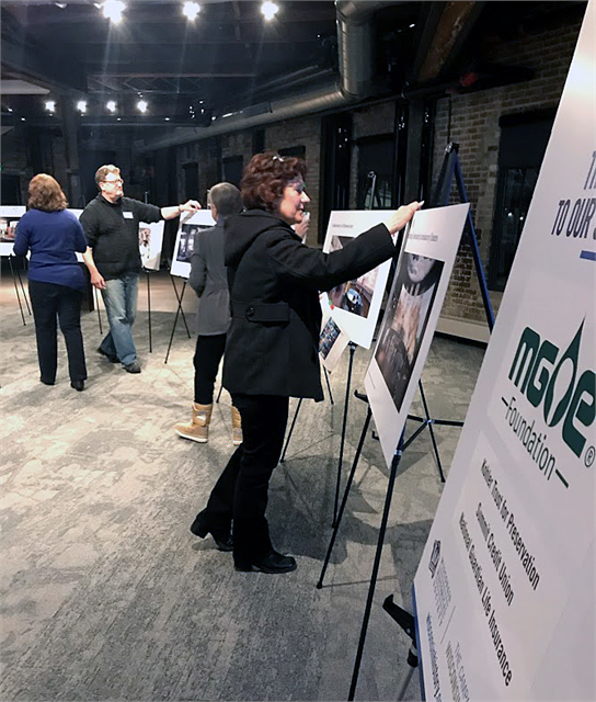 Guests place preference stickers on early concept exhibit design renderings during an exercise at the Wisconsin Historical Society's "Share Your Voice" new museum listening session held Feb. 21, 2019 at the Goodman Community Center in Madison.