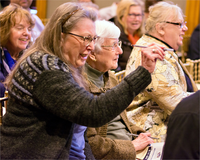 A guest chuckles with guests as she makes a point during the Society's "Share Your Voice" new museum public listening session March 13, 2019 in Waukesha.