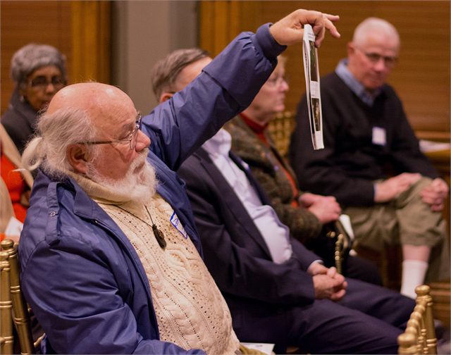 A guest holds up a concept exhibit design rendering as he makes comments March 13, 2019 during the Wisconsin Historical Society's "Share Your Voice" new museum listening session in Waukesha.