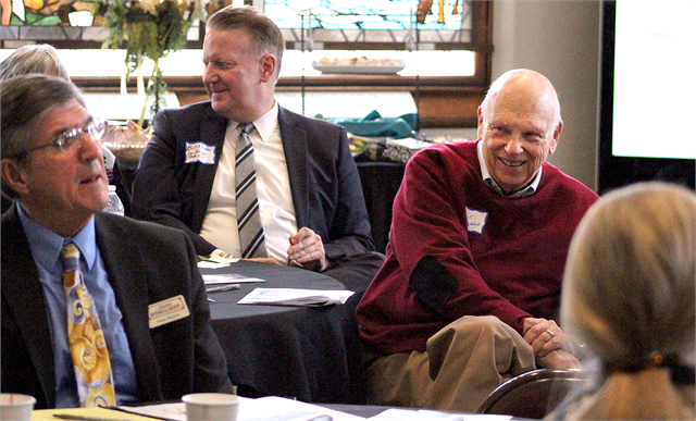 Appleton resident Walt Rugland, a member of the Wisconsin Historical Society's Board of Curators and a Wisconsin Historical Foundation Director Emeritus, enjoys a laugh with guests at the "Share Your Voice" new museum listening session in Appleton.