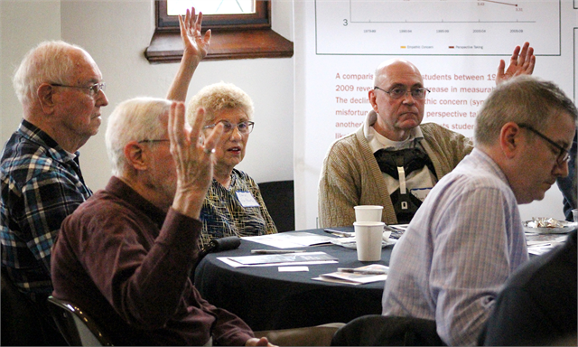 Guests raise their hands in response to a question during the Wisconsin Historical Society's "Share Your Voice" new museum session March 13, 2019 at The Museum at the Castle in Appleton.