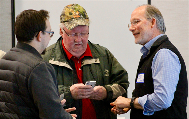George Austin, right, Project Manager for the Wisconsin Historical Society's new museum project, chats with guests as they arrive for the April 10, 2019 "Share Your Voice" listening session at Madison's Warner Park Community Recreation Center.