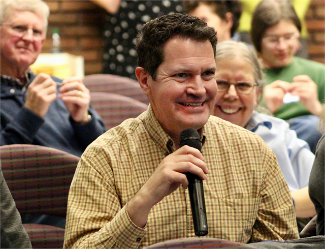 Billy Bergeron, vice president of the La Crosse Historical Society Board of Directors, enjoys a laugh with guests at the Wisconsin Historical Society's "Share Your Voice" new museum public listening session April 17, 2019 in La Crosse.