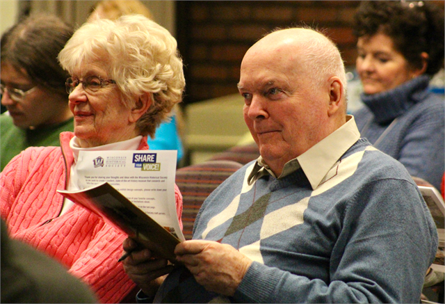 A couple listens to another guest talk about a potential new museum exhibit during the "Share Your Voice" listening session April 17, 2019 at the La Crosse Public Library.