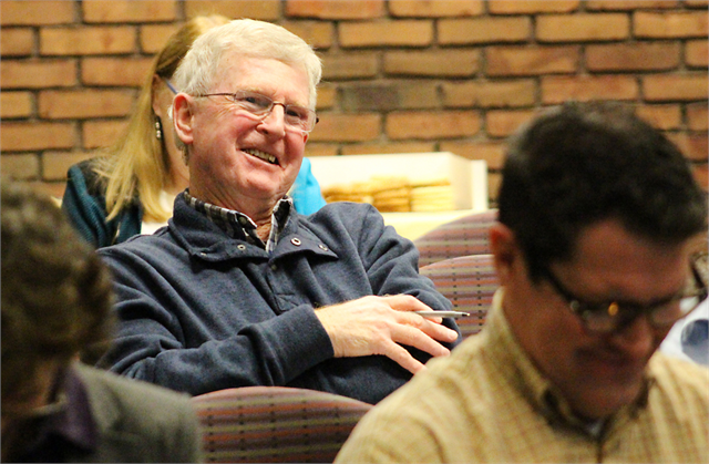 A man enjoys a laugh during the Wisconsin Historical Society's "Share Your Voice" new museum listening session in La Crosse.