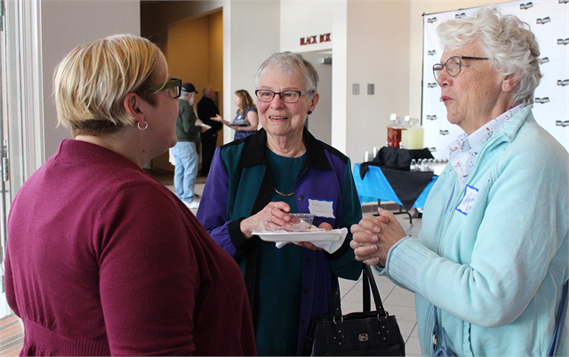 JoAnn Hallquist, middle, and Heidi Leeson, right, chat with Amy Norlin, Operations Program Associate with the Wisconsin Historical Society, after arriving at the "Share Your Voice" new museum listening session May 9, 2019 in Hudson.
