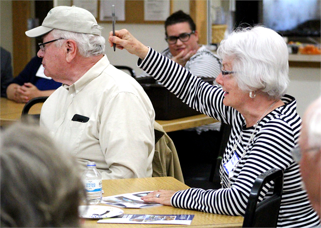 A guest raises her hand during the "Share Your Voice" new museum listening session May 29, 2019 at the Cameron Senior Center.