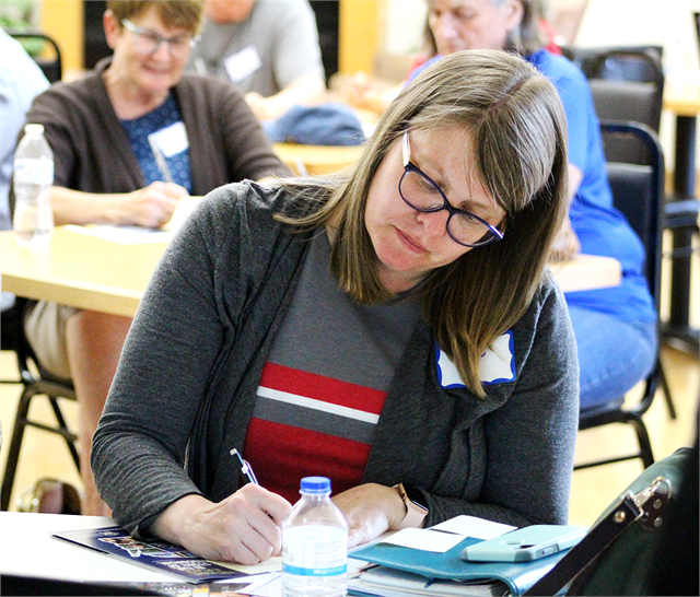 Jodi Kiffmeyer writes ideas for a new state history museum on Post-It notes during an activity at the Wisconsin Historical Society's "Share Your Voice" listening session for Barron County residents May 29, 2019 at the Cameron Senior Center.