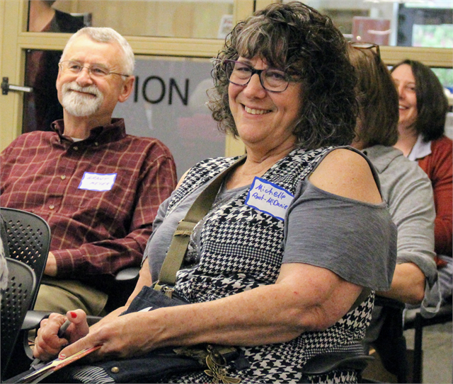 Michelle Root-McDaniel and Grant Meyer (left) smile as another guest tells a story during the Wisconsin Historical Society's "Share Your Voice" new museum listening session May 30, 2019 in Eagle River.