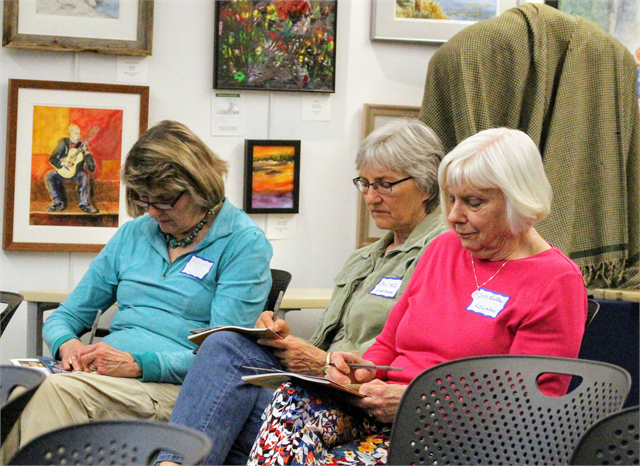 (From left) Barbara Nehring, Chris Tews and Lois Bates of the Land O' Lakes Historical Society write down ideas on Post-It notes during the Wisconsin Historical Society's "Share Your Voice" new museum listening session in Eagle River.