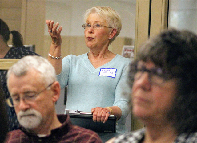 Karen Sailer, president of the Eagle River Historical Society, makes a point from the back of the room as guests discuss new museum ideas during the Wisconsin Historical Society's "Share Your Voice" listening session May 30, 2019 in Eagle River.