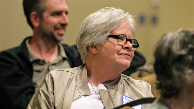 Barbara Feldner smiles as she listens to another guest talk about a potential exhibit for a new state history museum during the Wisconsin Historical Society's listening session June 18, 2019 in Whitefish Bay.