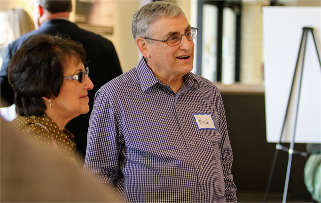 Rich and his wife Diane chat with State Archivist Matt Blessing as he shows rare artifacts from the Wisconsin Historical Society's collections prior to the "Share Your Voice" new museum listening session June 18, 2019 in Whitefish Bay.
