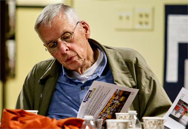 John Hattenhauer of Wausau examines a packet of new museum concept exhibit design renderings during the "Share Your Voice" listening session at the Marathon County Historical Society's Woodson Center in Wausau.