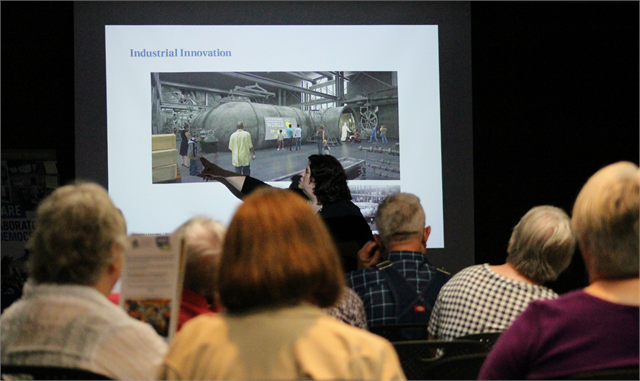 Alicia Goehring, Director of Special Projects and Interim Director of Programs & Outreach for the Wisconsin Historical Society, describes an Industrial Innovation concept exhibit design rendering during the new museum listening session in Eau Claire.