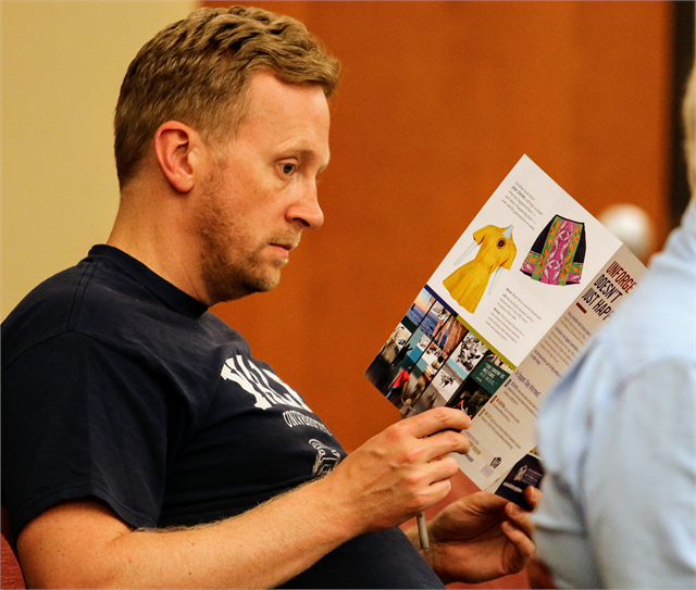 Dan Berg reviews informational materials about the Wisconsin Historical Society's new state history museum project during the "Share Your Voice" listening session June 27, 2019 at the St. Francis Civic Center.