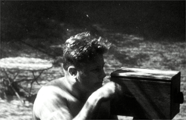 Diver Max Nohl using a camera to film underwater