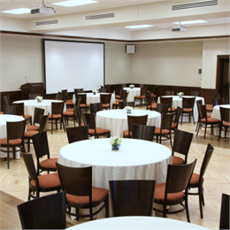 A room setup for a lecture and lunch.