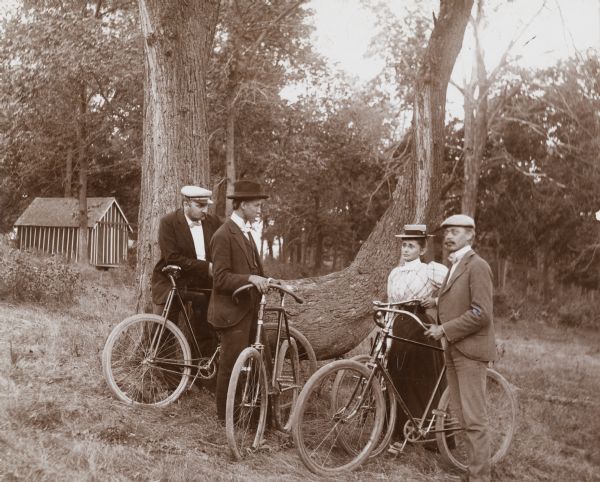 Bicyclists Standing Near a Tree, WHI 68012.