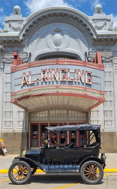 Photo of the exterior of the Al. Ringling Theatre, an ornate building with an antique car out front