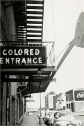 Exterior view of the segregated entrance for African-Americans at Malco Theater.