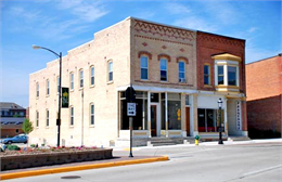 Exterior of commercial main street brick buildings.