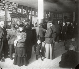 Immigrants buying tickets at Ellis Island.