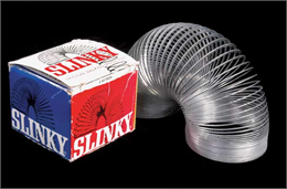 Metal slinky toy with original blue and red box.
