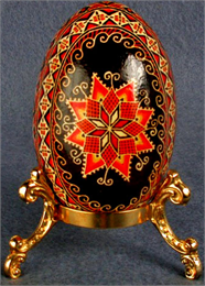 Red, black and yellow decorative Ukrainian Easter egg.