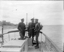 Major McArdle with two British officers in uniform on board the launch "Wisconsin."