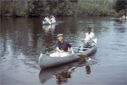 Gaylord Nelson participates in a canoe trip down the Namekagon River in an effort to protect the river under the National Wild and Scenic Rivers Act.