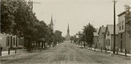 View down street in Cedarburg with a large church at the end.