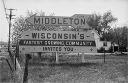 A sign reading "Middleton, Wisconsin's Fastest Growing Community Invites You".