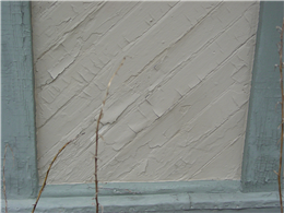 Image of loose paint that was not removed prior to repainting.