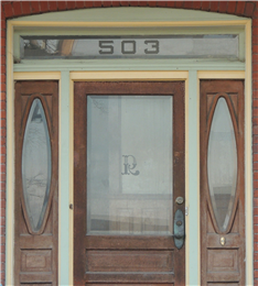 This door and transom have an acid etched letter and address.