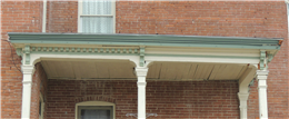 Image of failing porch, with sagging box beam.